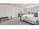 Stylishly staged primary bedroom featuring neutral decor and ample natural light at 11131 Cardinal Creek Ave, Charlotte, NC 28215