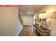 Inviting hallway features wood-look floors and decorative console table at 11213 Cardinal Creek Ave, Charlotte, NC 28215