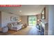 Bright living room features a fireplace and a sliding glass door to the backyard at 11213 Cardinal Creek Ave, Charlotte, NC 28215