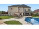 Inviting backyard featuring a swimming pool, lounge chairs and outdoor dining area at 113 Dairy Farm Rd, Mooresville, NC 28115