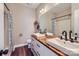 Bathroom with dual sinks, wood countertop, and modern fixtures at 113 Dairy Farm Rd, Mooresville, NC 28115
