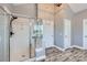 Bathroom featuring a glass-enclosed shower, modern fixtures, and ample natural light at 113 Dairy Farm Rd, Mooresville, NC 28115