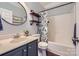 Updated bathroom featuring modern fixtures, decorative shelving and a shower-tub combo at 113 Dairy Farm Rd, Mooresville, NC 28115