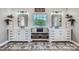 Bathroom with double sinks, white cabinetry, and modern lighting fixtures at 113 Dairy Farm Rd, Mooresville, NC 28115