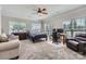 Spacious bedroom featuring a sitting area, desk, ceiling fan and plush carpeting at 113 Dairy Farm Rd, Mooresville, NC 28115