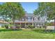 Attractive two-story home with manicured lawn, mature trees, and classic architectural details at 113 Dairy Farm Rd, Mooresville, NC 28115