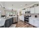 Well-appointed kitchen with stainless steel appliances, granite countertops, modern lighting, and hardwood floors at 113 Dairy Farm Rd, Mooresville, NC 28115