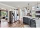 Modern kitchen with a stainless steel refrigerator, island with sink, hardwood floors, and open layout at 113 Dairy Farm Rd, Mooresville, NC 28115