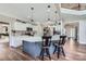 Open kitchen featuring a large island, pendant lighting, and views to the entryway at 113 Dairy Farm Rd, Mooresville, NC 28115