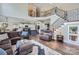 Spacious living room featuring a staircase, hardwood floors, comfortable seating, and an open design at 113 Dairy Farm Rd, Mooresville, NC 28115