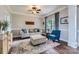 Cozy living room features hardwood floors, natural light, and a sofa with blue accents at 113 Dairy Farm Rd, Mooresville, NC 28115