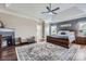 Spacious main bedroom with a fireplace, king-size bed, and decorative rug at 113 Dairy Farm Rd, Mooresville, NC 28115