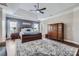 Spacious main bedroom with a tray ceiling, ensuite bath, and a lovely accent wall at 113 Dairy Farm Rd, Mooresville, NC 28115