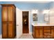 Stylish bathroom with double vanity, wood cabinets, and access to the main bedroom at 139 Harper Lee St, Davidson, NC 28036