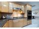Kitchen showcases granite countertops, stainless steel appliances, and custom cabinetry at 139 Harper Lee St, Davidson, NC 28036