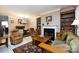 Spacious living room with fireplace, built-in bookshelves, and comfortable seating area at 139 Harper Lee St, Davidson, NC 28036