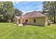 The home features a well-maintained lawn, patio, and mature trees, great for Gathering time at 13930 Wild Heather Ct, Charlotte, NC 28273