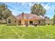 Expansive backyard features a patio, lush green lawn, perfect for outdoor entertaining at 13930 Wild Heather Ct, Charlotte, NC 28273
