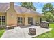 Patio with a fire pit and grill, ideal for outdoor gatherings and relaxation at 13930 Wild Heather Ct, Charlotte, NC 28273