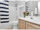 Well-maintained bathroom with shower-tub, vanity with storage, and modern fixtures at 13930 Wild Heather Ct, Charlotte, NC 28273