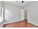 Inviting bedroom offers wood floors and natural light, creating a welcoming atmosphere at 13930 Wild Heather Ct, Charlotte, NC 28273