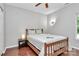 Cozy bedroom with wood floors, ceiling fan, closet and window with a view at 13930 Wild Heather Ct, Charlotte, NC 28273