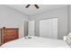 Comfortable bedroom with closet, wood floor, and large window with natural light at 13930 Wild Heather Ct, Charlotte, NC 28273