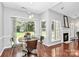 Dining room with hardwood floors and views of both the backyard and the living room at 13930 Wild Heather Ct, Charlotte, NC 28273