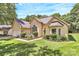 Charming front exterior with manicured landscaping, and attached garage for convenience at 13930 Wild Heather Ct, Charlotte, NC 28273