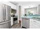 Bright kitchen features stainless steel appliances, light cabinetry and stylish counter tops at 13930 Wild Heather Ct, Charlotte, NC 28273