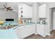 Charming kitchen features white cabinets, unique countertops and modern fixtures at 13930 Wild Heather Ct, Charlotte, NC 28273