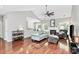 Open-concept living room features a fireplace, vaulted ceilings, and hardwood floors at 13930 Wild Heather Ct, Charlotte, NC 28273