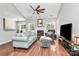 Spacious living room with hardwood floors, a fireplace, and plenty of natural light at 13930 Wild Heather Ct, Charlotte, NC 28273