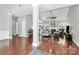Spacious living room featuring hardwood floors, fireplace, ceiling fan, and neutral paint tones at 13930 Wild Heather Ct, Charlotte, NC 28273