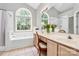 Bright main bathroom with double vanity, soaking tub, and large windows at 13930 Wild Heather Ct, Charlotte, NC 28273