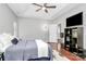 Cozy main bedroom features tray ceilings, hardwood floors, and ensuite bathroom access at 13930 Wild Heather Ct, Charlotte, NC 28273