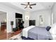 Spacious main bedroom features tray ceiling, hardwood floors, and ensuite bathroom at 13930 Wild Heather Ct, Charlotte, NC 28273