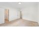 Bedroom with walk-in closet and bright lighting is awaiting decor and design at 15216 Ballantyne Country Club Dr, Charlotte, NC 28277