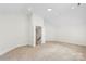 Spacious room with door leading to a hallway is ready for your personal touch at 15216 Ballantyne Country Club Dr, Charlotte, NC 28277