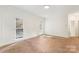 A bright bonus room featuring neutral carpeting, white trim, and multiple windows at 15216 Ballantyne Country Club Dr, Charlotte, NC 28277