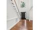 Elegant foyer with hardwood floors, staircase, high ceilings, and arched window above front door at 15216 Ballantyne Country Club Dr, Charlotte, NC 28277