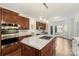 Spacious kitchen featuring a large island, stainless steel appliances, and ample cabinetry at 15216 Ballantyne Country Club Dr, Charlotte, NC 28277