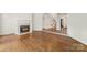 Spacious living room showcasing hardwood floors and an elegant fireplace at 15216 Ballantyne Country Club Dr, Charlotte, NC 28277