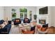 Comfortable living room with fireplace, large windows, and stylish furnishings at 15216 Ballantyne Country Club Dr, Charlotte, NC 28277