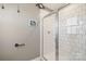 Modern bathroom featuring a glass-enclosed shower with white subway tile at 1708 Speartip Ln, Denver, NC 28037