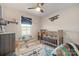 Brightly decorated bedroom with airplane-themed decor and a cozy crib at 1708 Speartip Ln, Denver, NC 28037