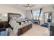 Comfortable bedroom with a large bed, soft lighting, and a view of the backyard at 1708 Speartip Ln, Denver, NC 28037