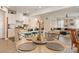 Open-concept kitchen and dining area with a granite countertop island and modern lighting fixtures at 1708 Speartip Ln, Denver, NC 28037