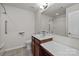 Bright bathroom features a vanity with storage, a sink, toilet, and shower with grab bars for convenience at 1814 Still Water Ln, Fort Mill, SC 29707