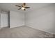 Bedroom features neutral carpet and a ceiling fan, providing a calming atmosphere at 1814 Still Water Ln, Fort Mill, SC 29707